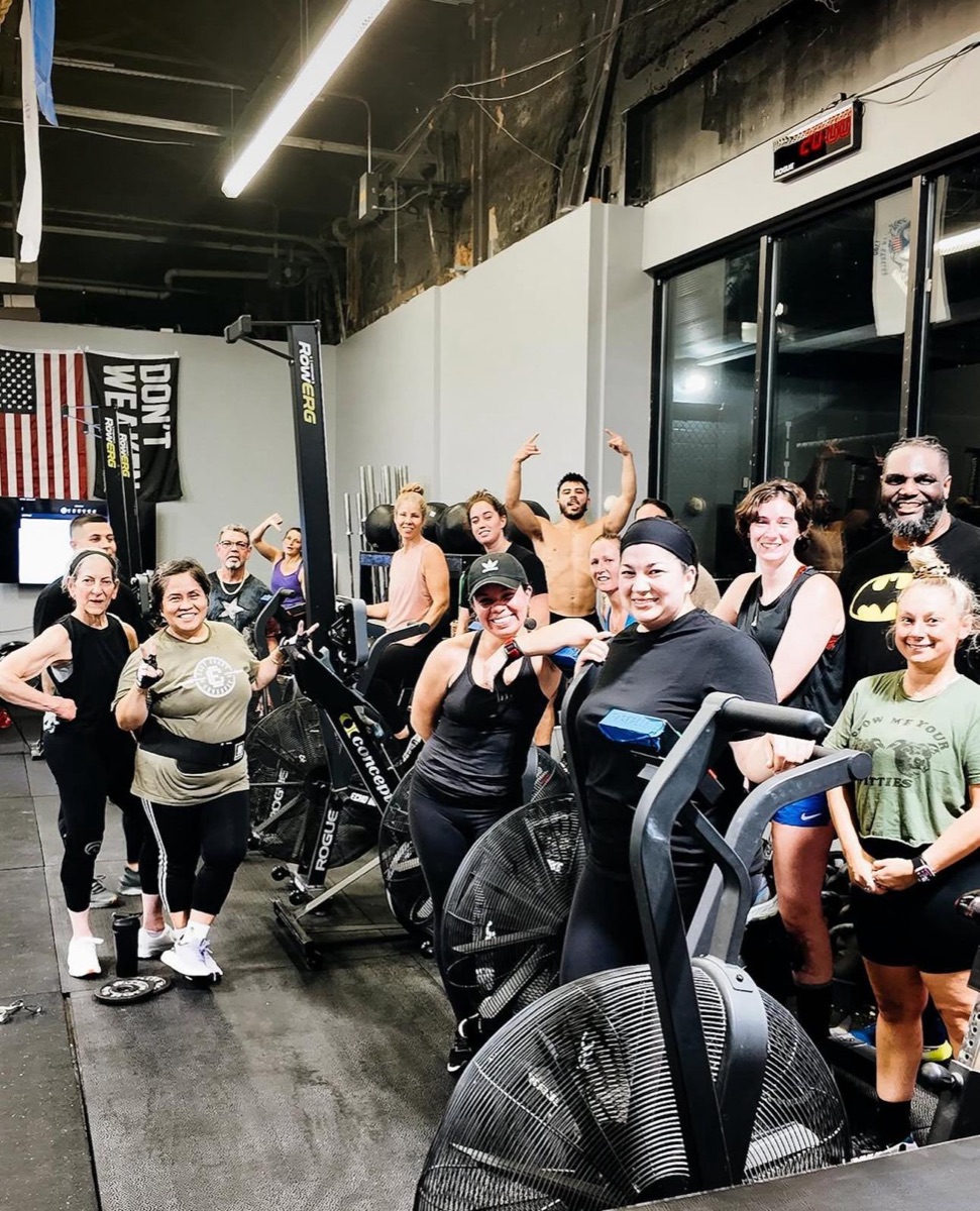 Members smiling together during a group class